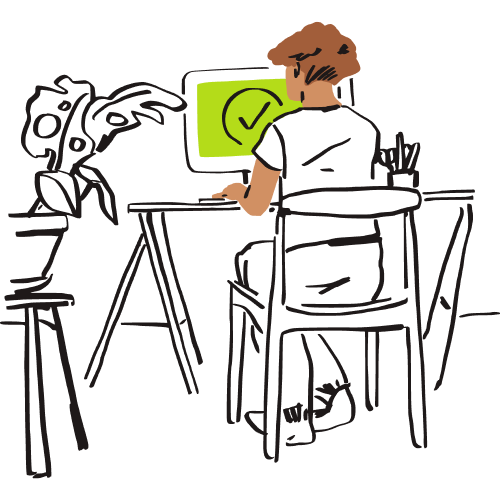 A person working on a computer at their desk.