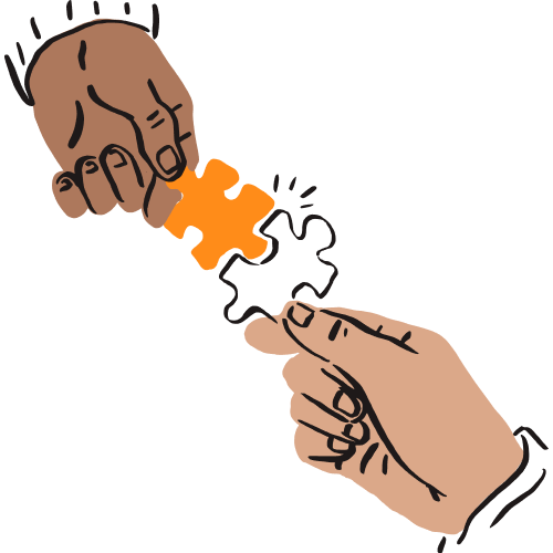 Two hands fit two puzzle pieces together.