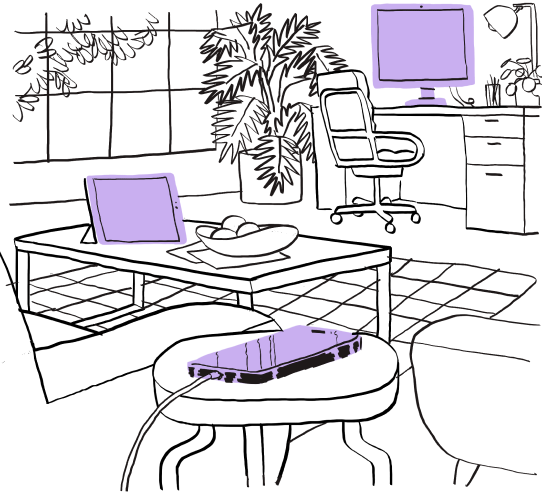 A room showing a computer screen, tablet, and mobile device on charge.