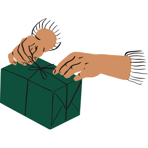 A person ties a bow on top of a wrapped gift.