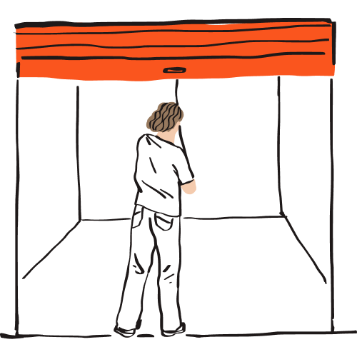 A person looking into a storage unit with nothing in it.