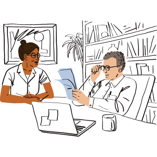 Two people working at a desk.